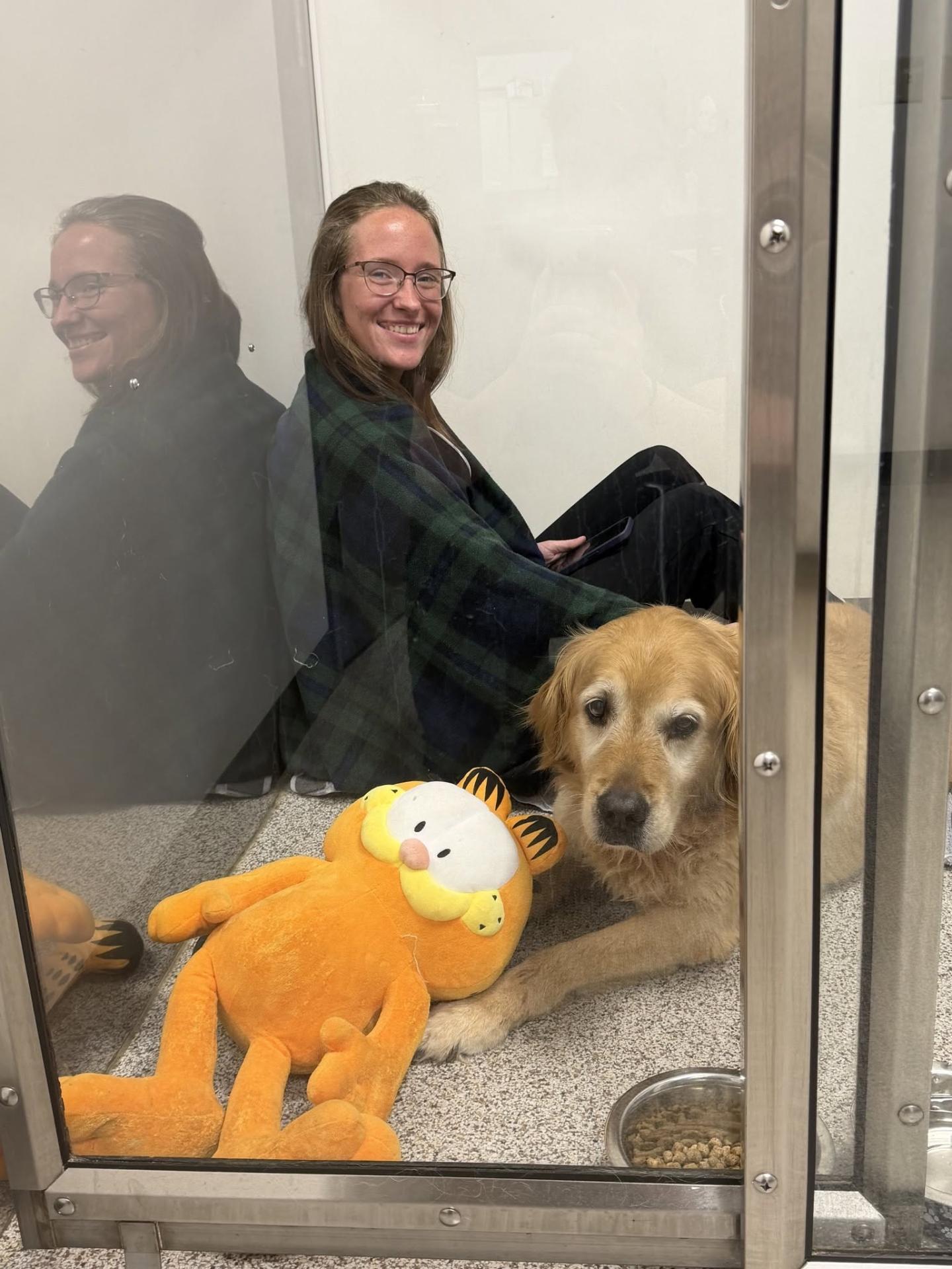 Veterinary Staff Member Keeping Dog Company